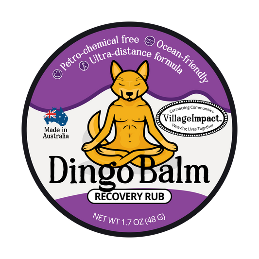 Label of Dingo Balm recovery rub featuring an illustration of a dingo sitting in a meditation pose with text detailing product information.